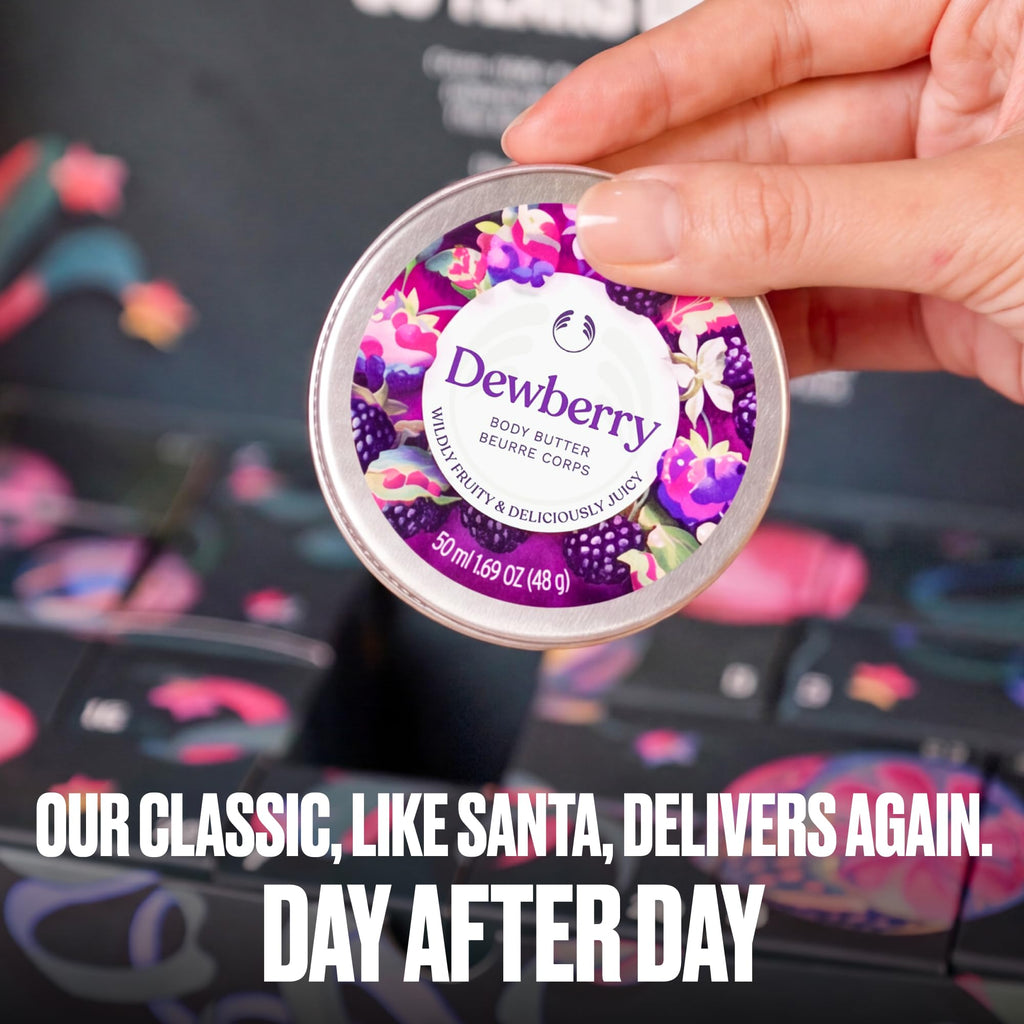 Hand holding a Dewberry body butter tin from the advent calendar set