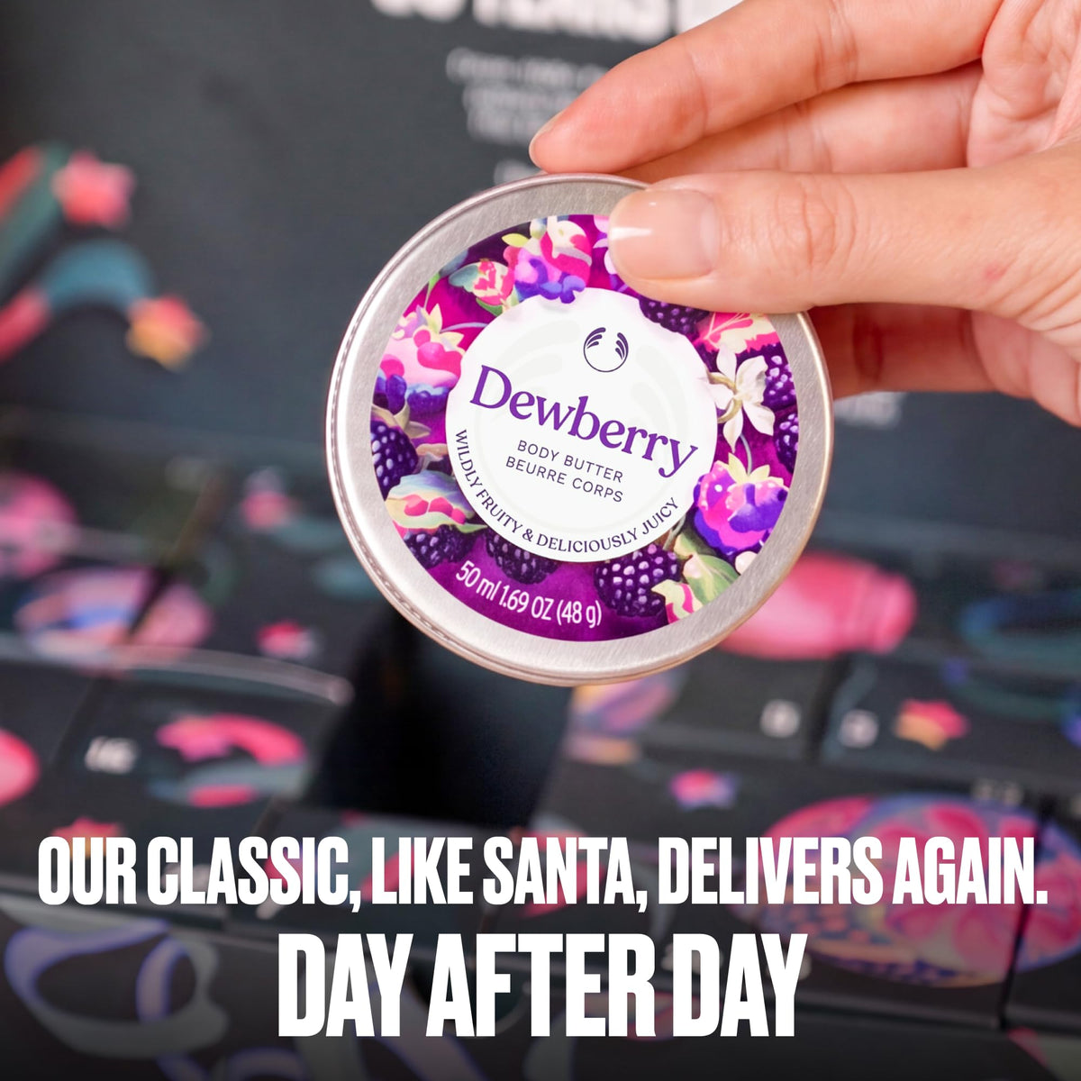 Hand holding a Dewberry body butter tin from the advent calendar set