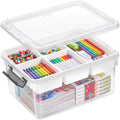 A clear plastic storage organizer box with a hinged lid, shown open and filled with colorful school supplies, beads, pencils, markers, and boxed items on a white background.
