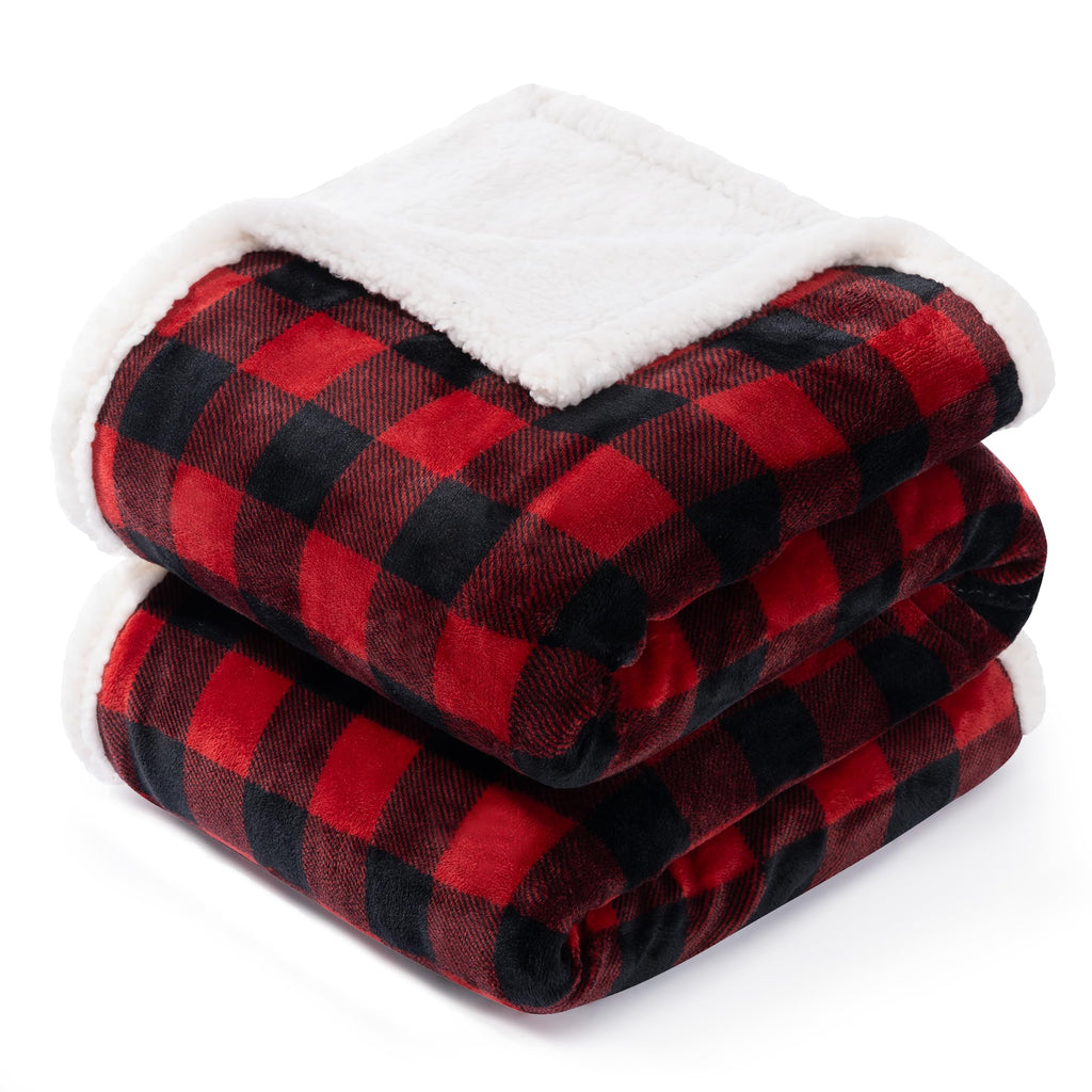 Red and black checkered blanket with white sherpa lining on a white background