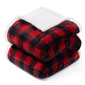 Red and black checkered blanket with white sherpa lining on a white background