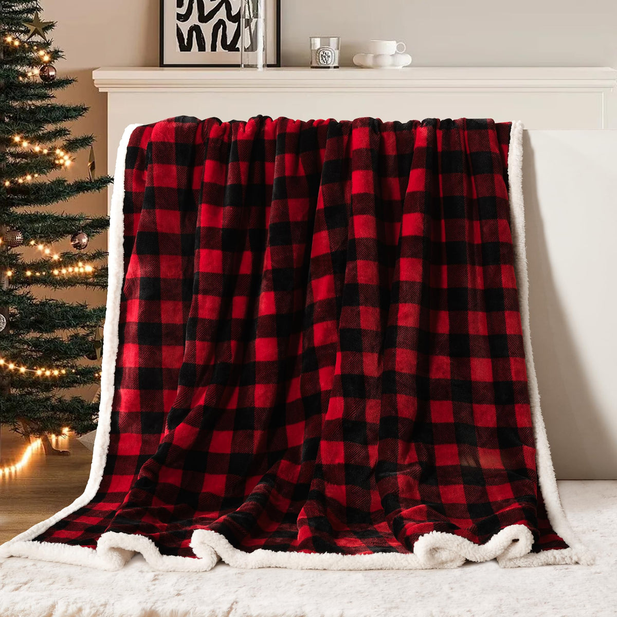 Red and black checkered blanket draped over a fireplace with a Christmas tree in the background.