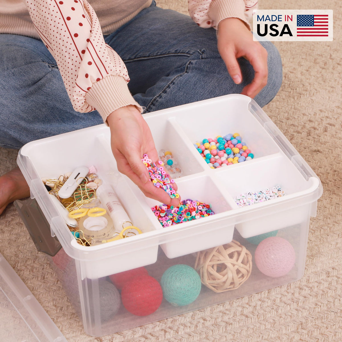 Person sorting colorful beads into a clear storage box with 'Made in USA' label.
