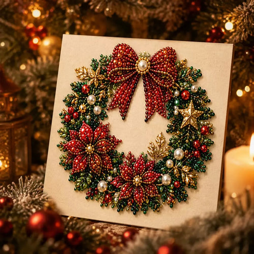 A square beaded Christmas wreath craft piece with a large red bow, red poinsettias, green leaves, gold accents, and pearl-like beads, displayed against a festive holiday background with lights and ornaments.