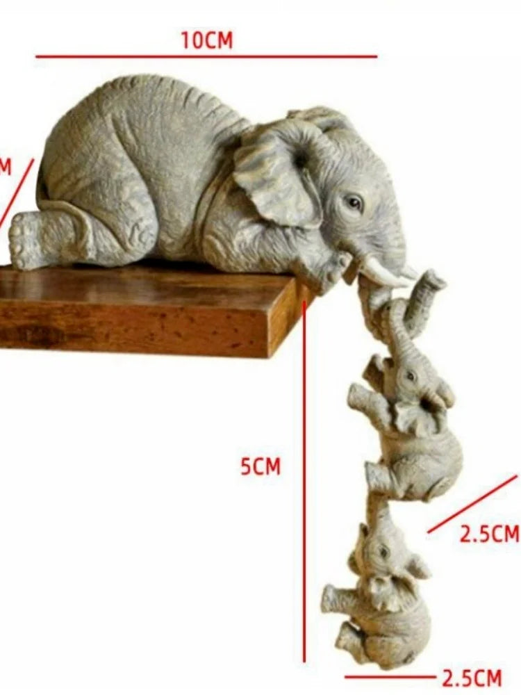 Dimension diagram of elephant figurine set showing mama elephant at 10cm wide and baby elephants at 5cm tall and 2.5cm wide