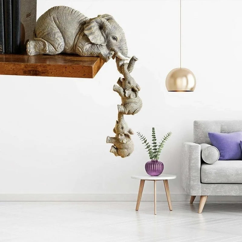 Elephant family figurine set styled on floating shelf in modern living room with sofa and pendant light in background