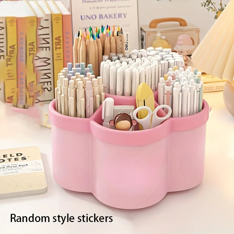 Pink 360-degree rotating desk organizer filled with markers colored pencils and scissors beside stacked books on a white desk with Random Style Stickers label