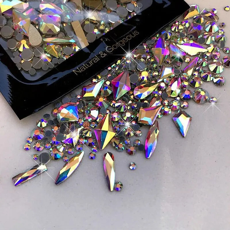 Multicolored rhinestones with a black container labeled 'Natural & Gallicous' on a light gray background.